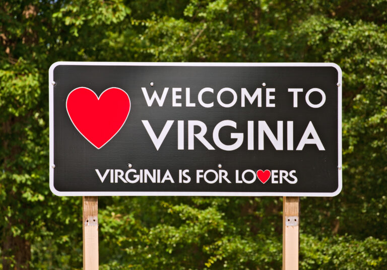 Welcome to Virginia sign with a green forest in the background